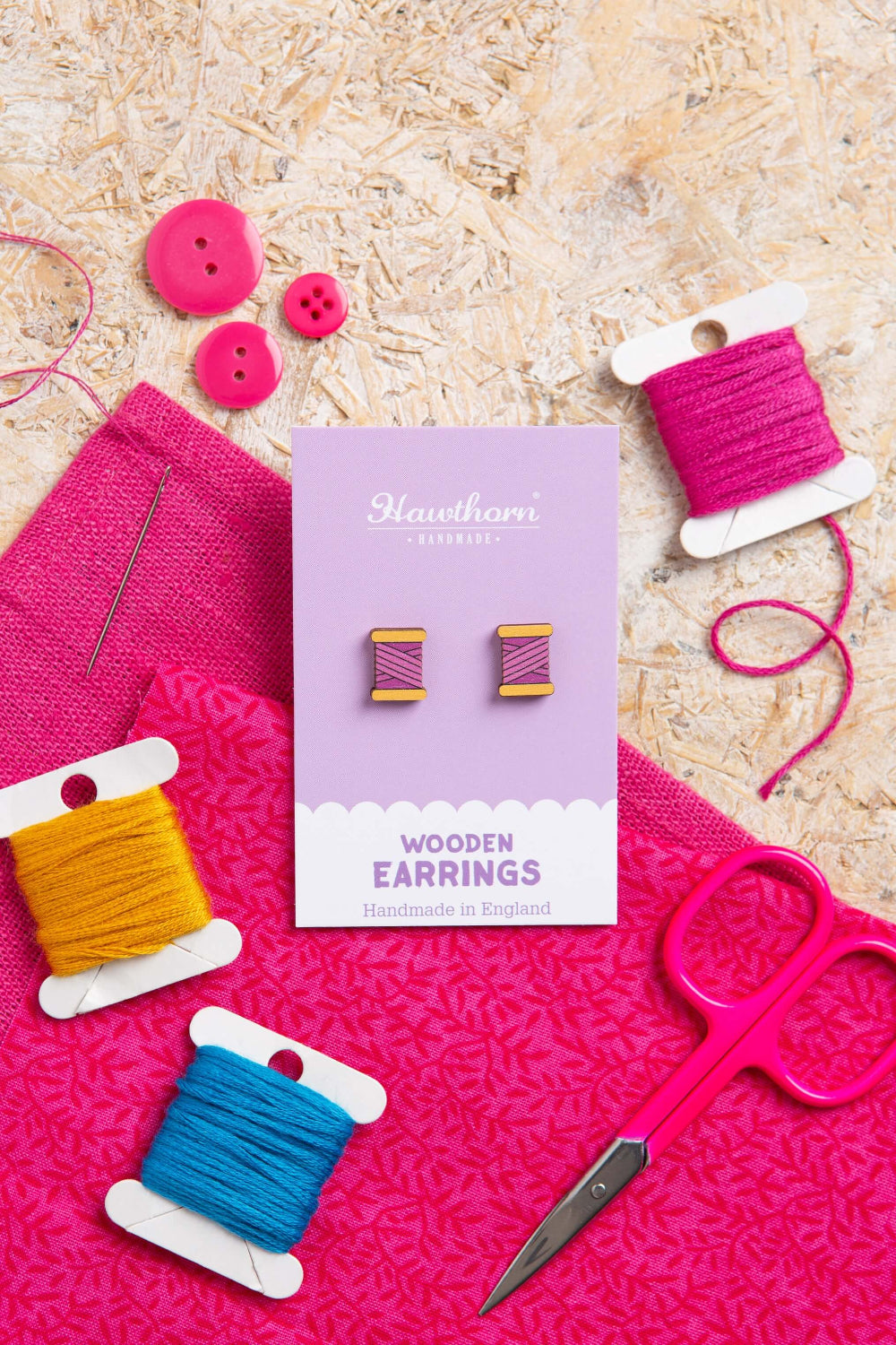 purple bobbin wooden earrings with yarn