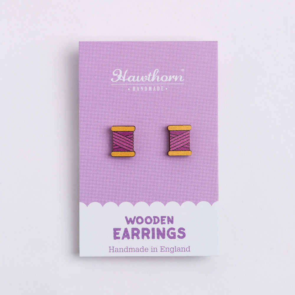 purple bobbin wooden earrings on card