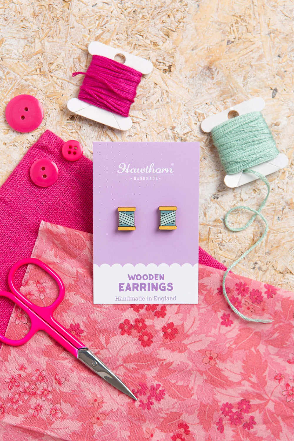 teal bobbin wooden earrings with yarn