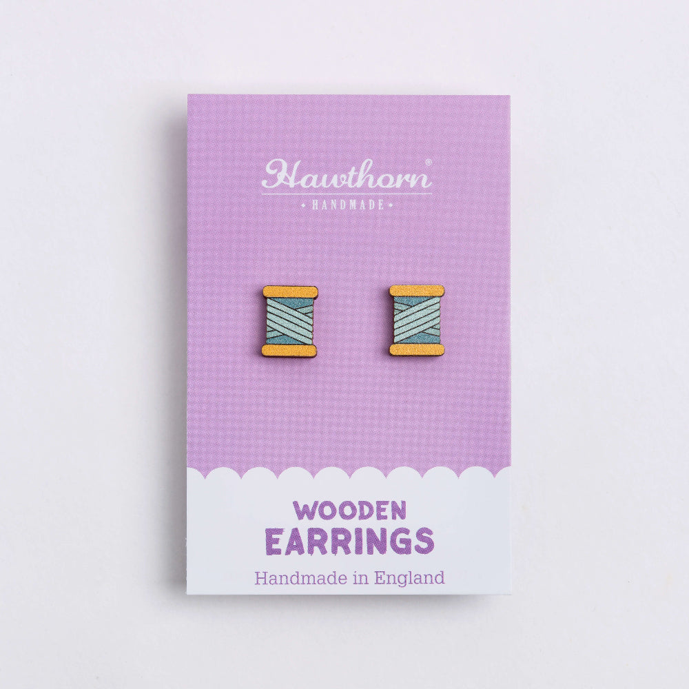 teal bobbin wooden earrings on card
