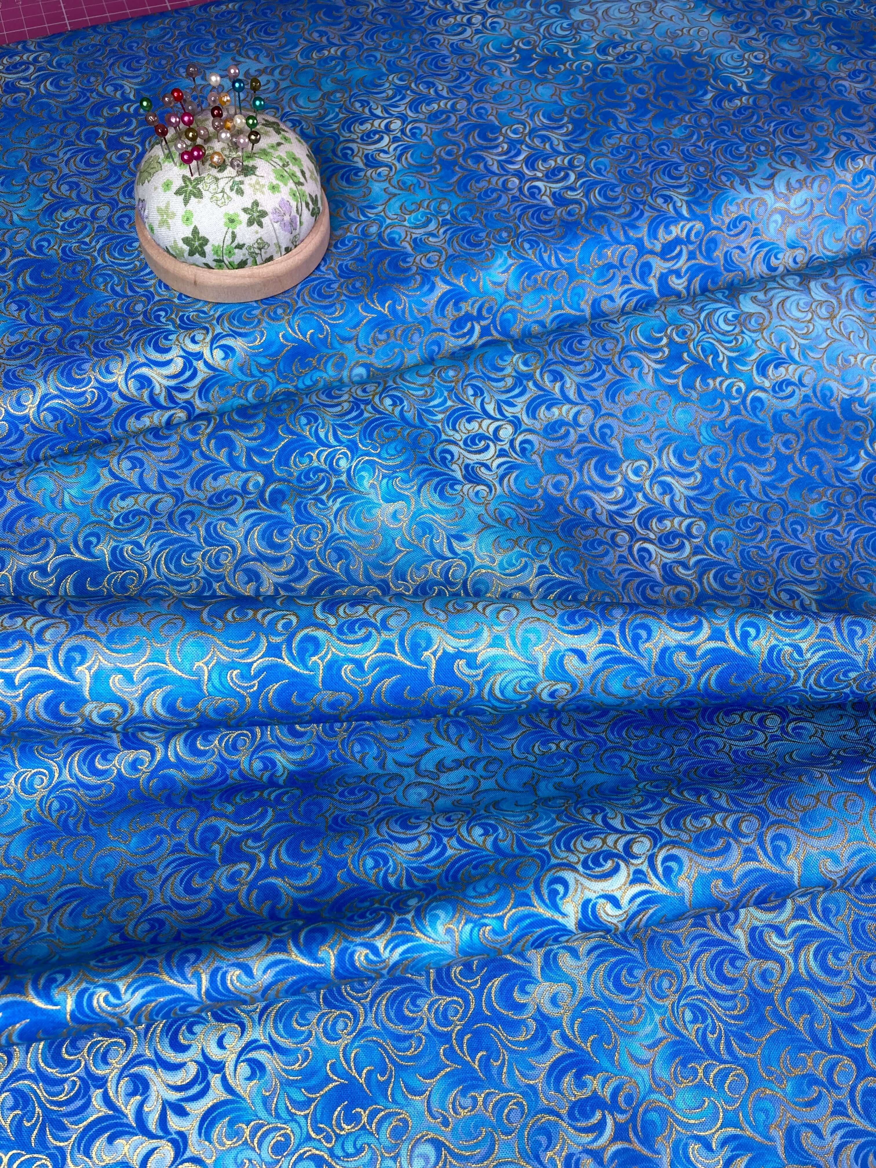 Blue and metallic gold intricate swirling patterned cotton fabric