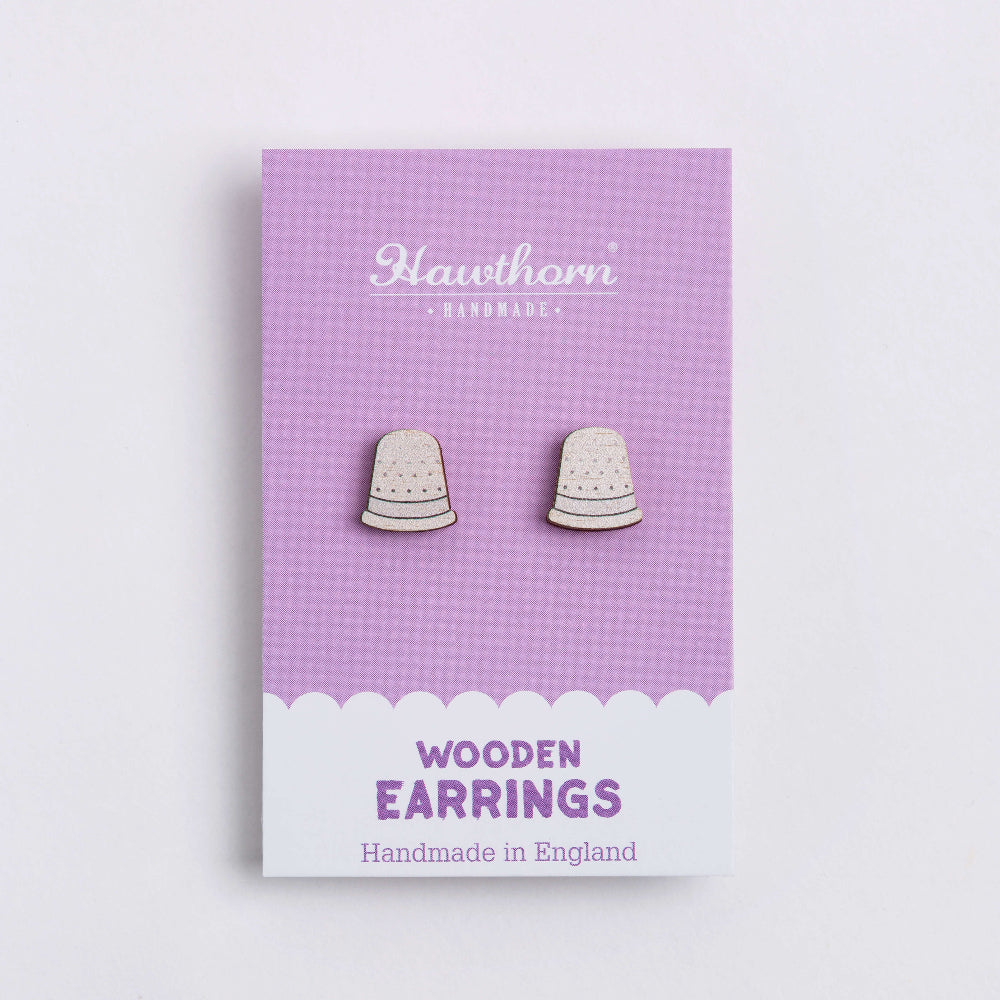 white thimble wooden earrings on card