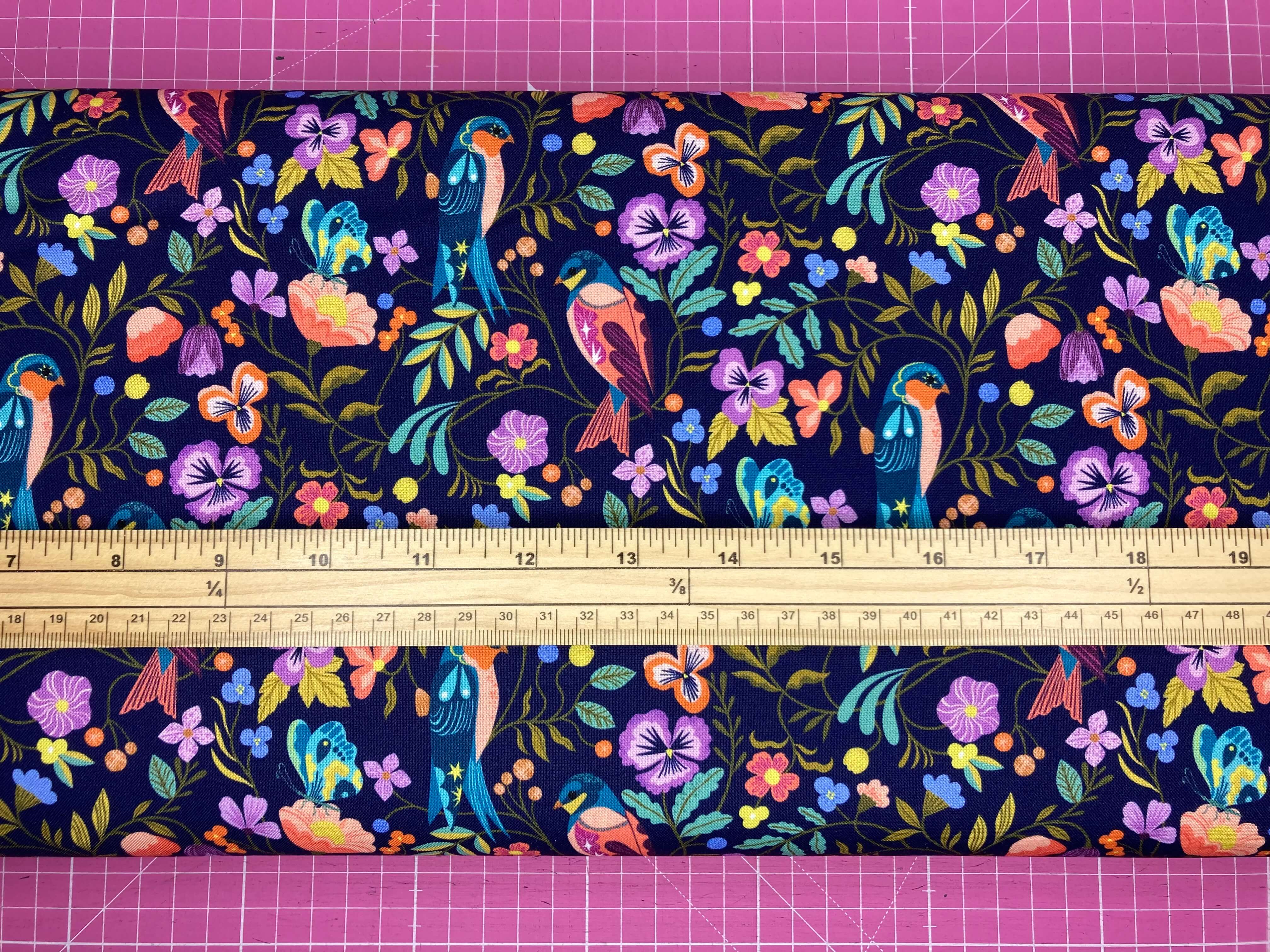 Colorful pattern of birds and flowers on a dark blue background