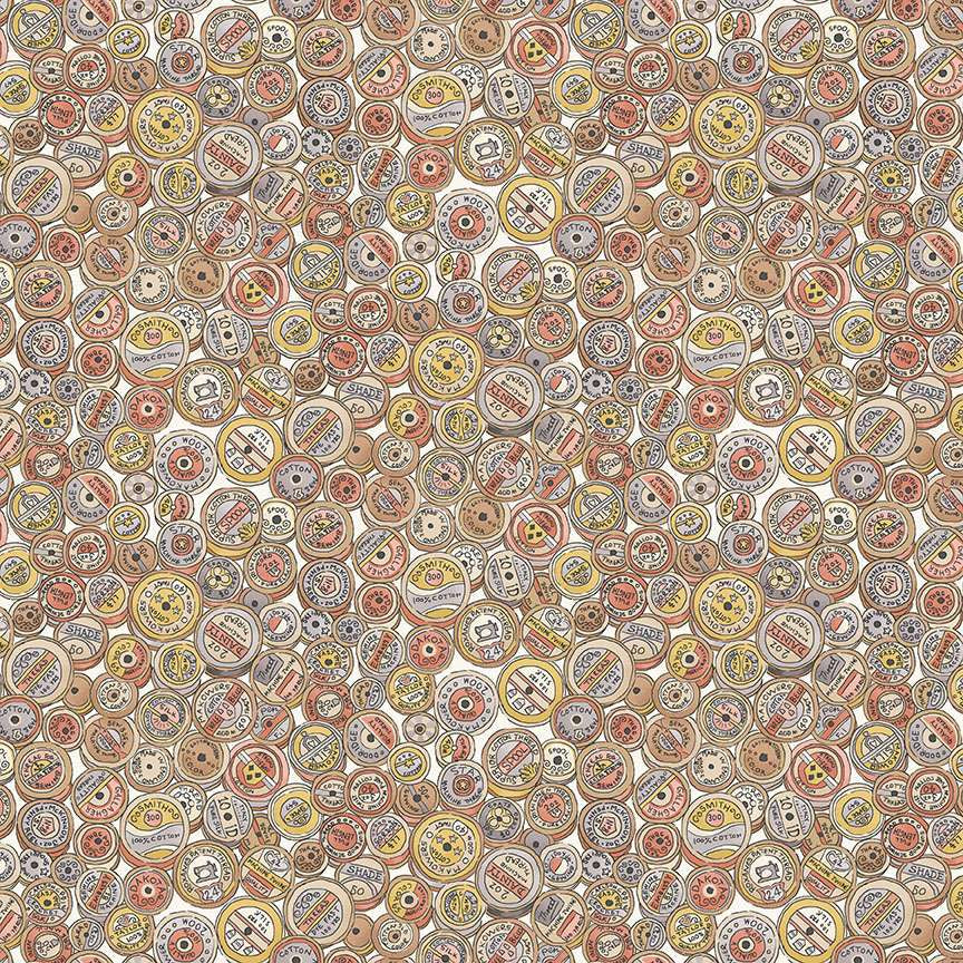 vintage themed cotton spools in pastel pinks greys and yellows on a cream cotton fabric