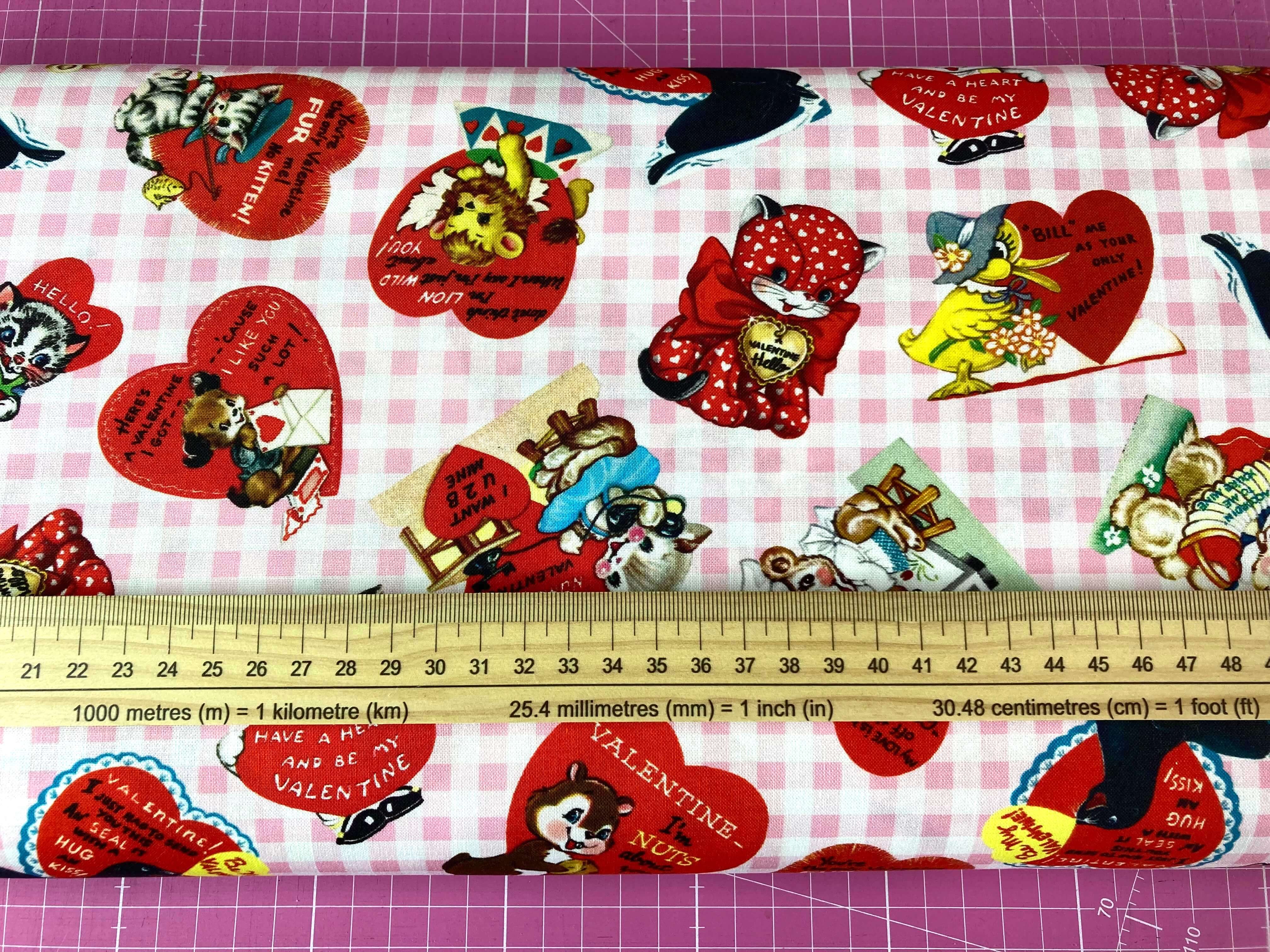 pink check fabric with retro love hearts and love messages with a ruler