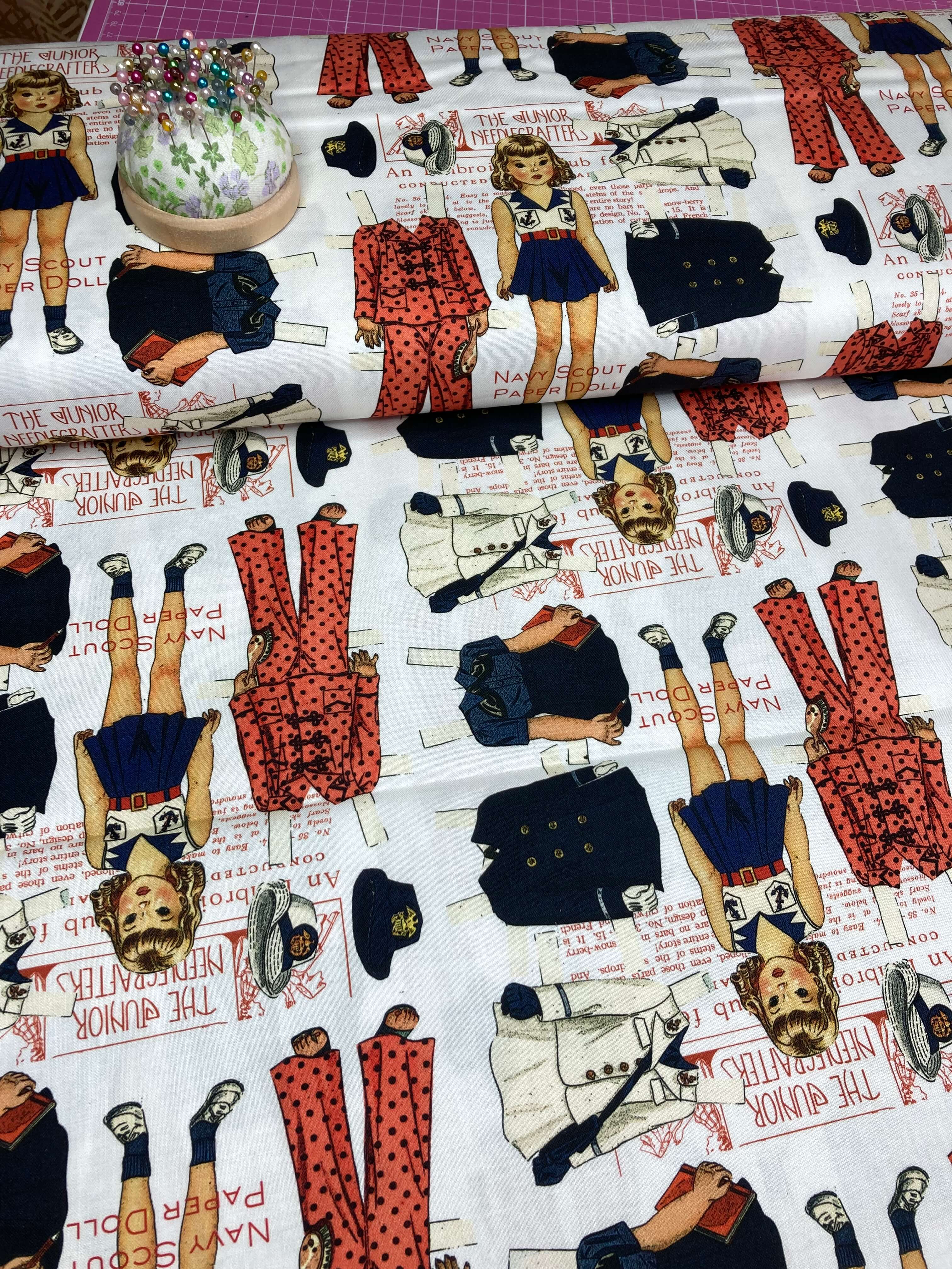 Fabric with illustrations of a girl in various poses and outfits on a white background.
