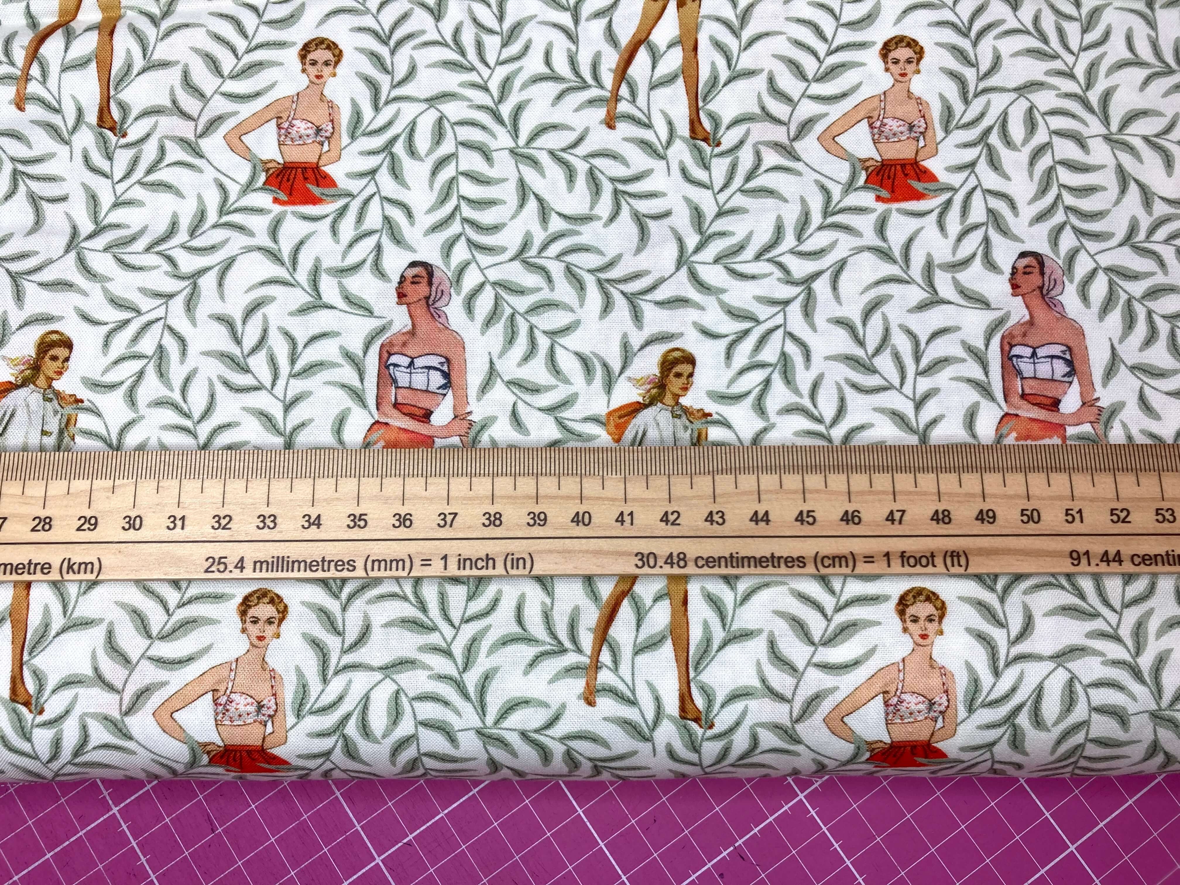 retro ladies on a white cotton fabric with lush green vines