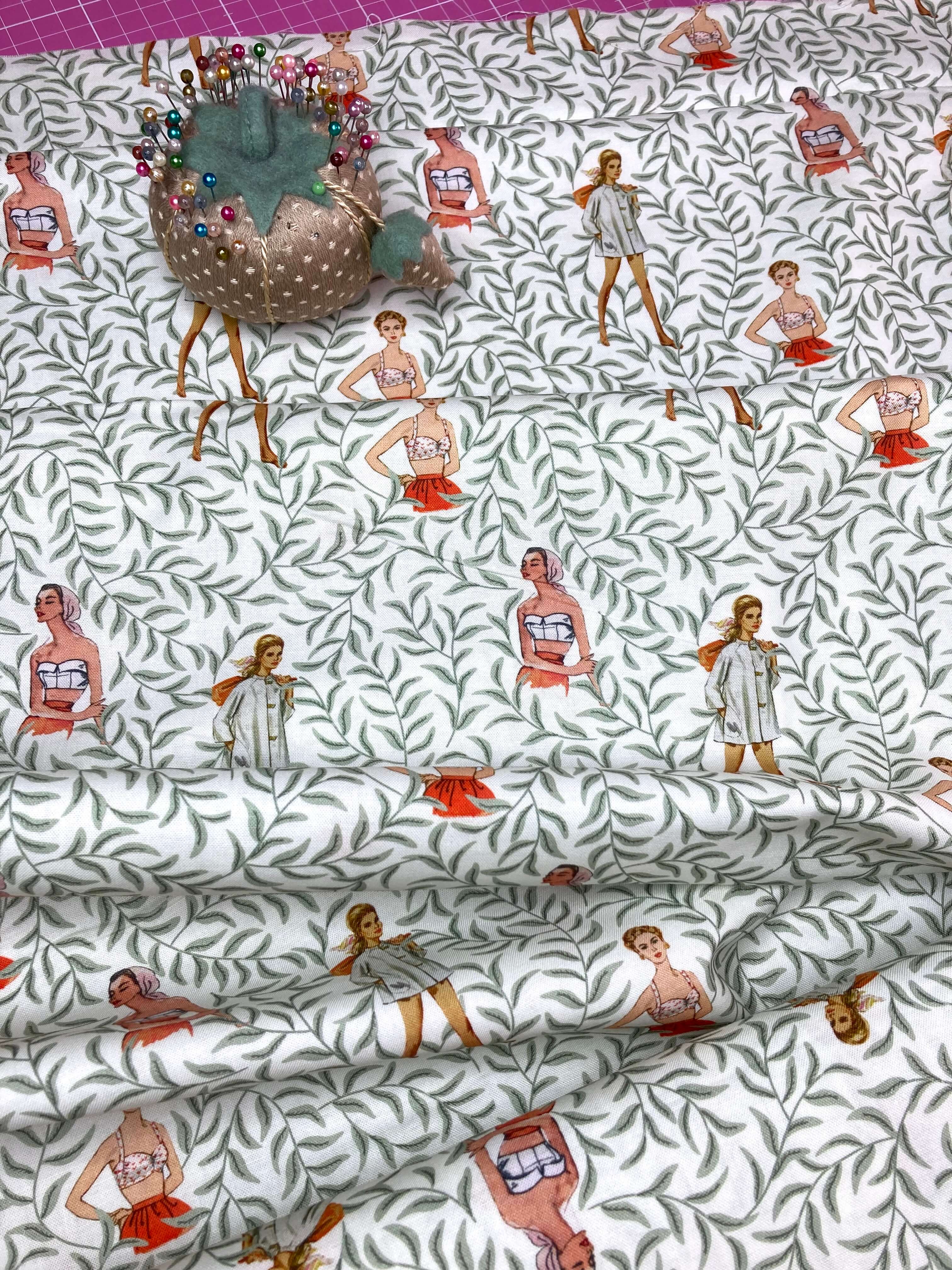 retro ladies on a white cotton fabric with lush green vines