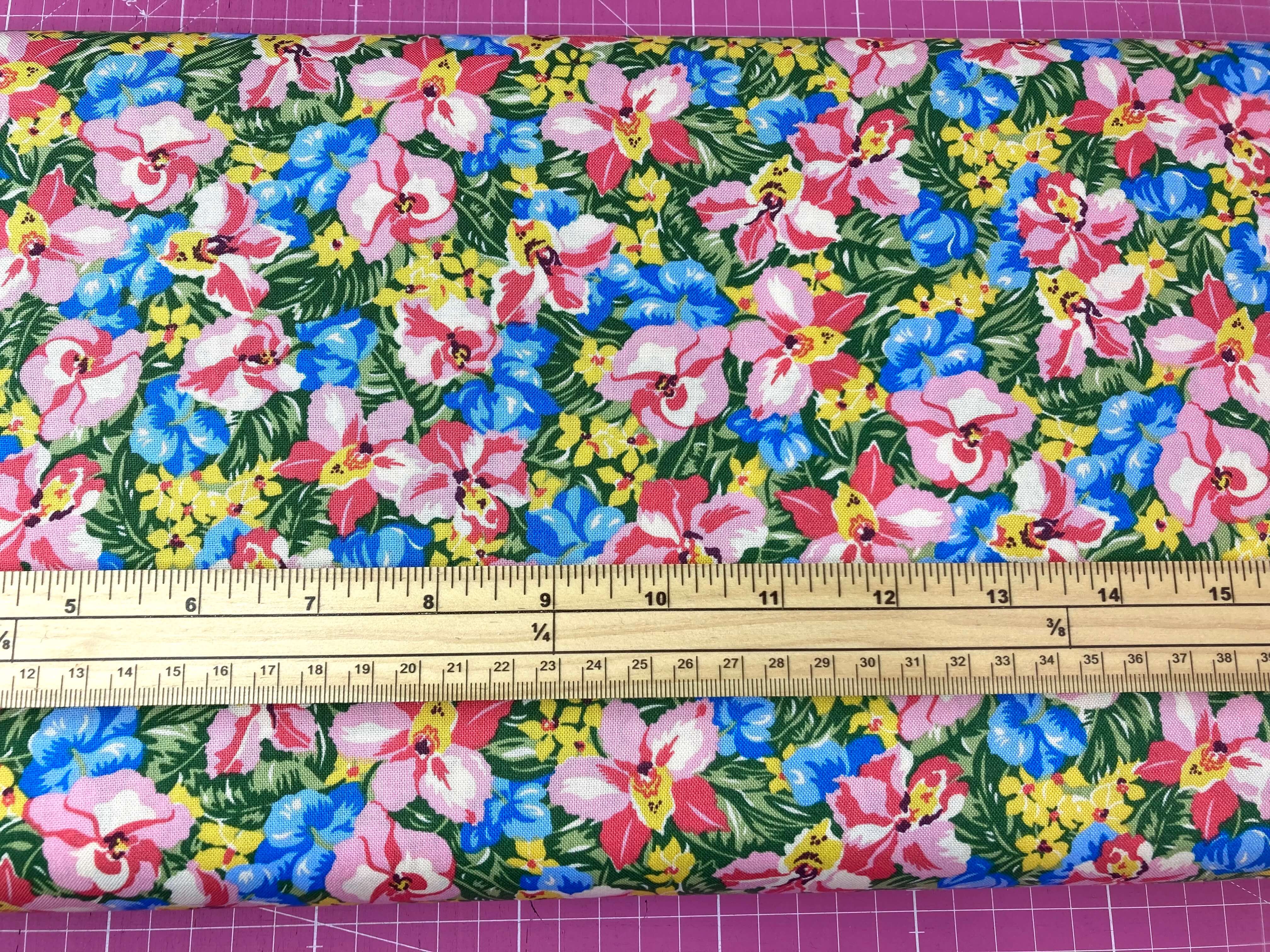 vibrant tropical floral liberty print fabric with blue pink and yellow flowers