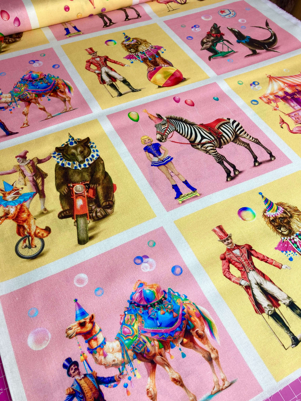 michael miller a night at the circus fabric with circus scenes on pink and yellow cotton