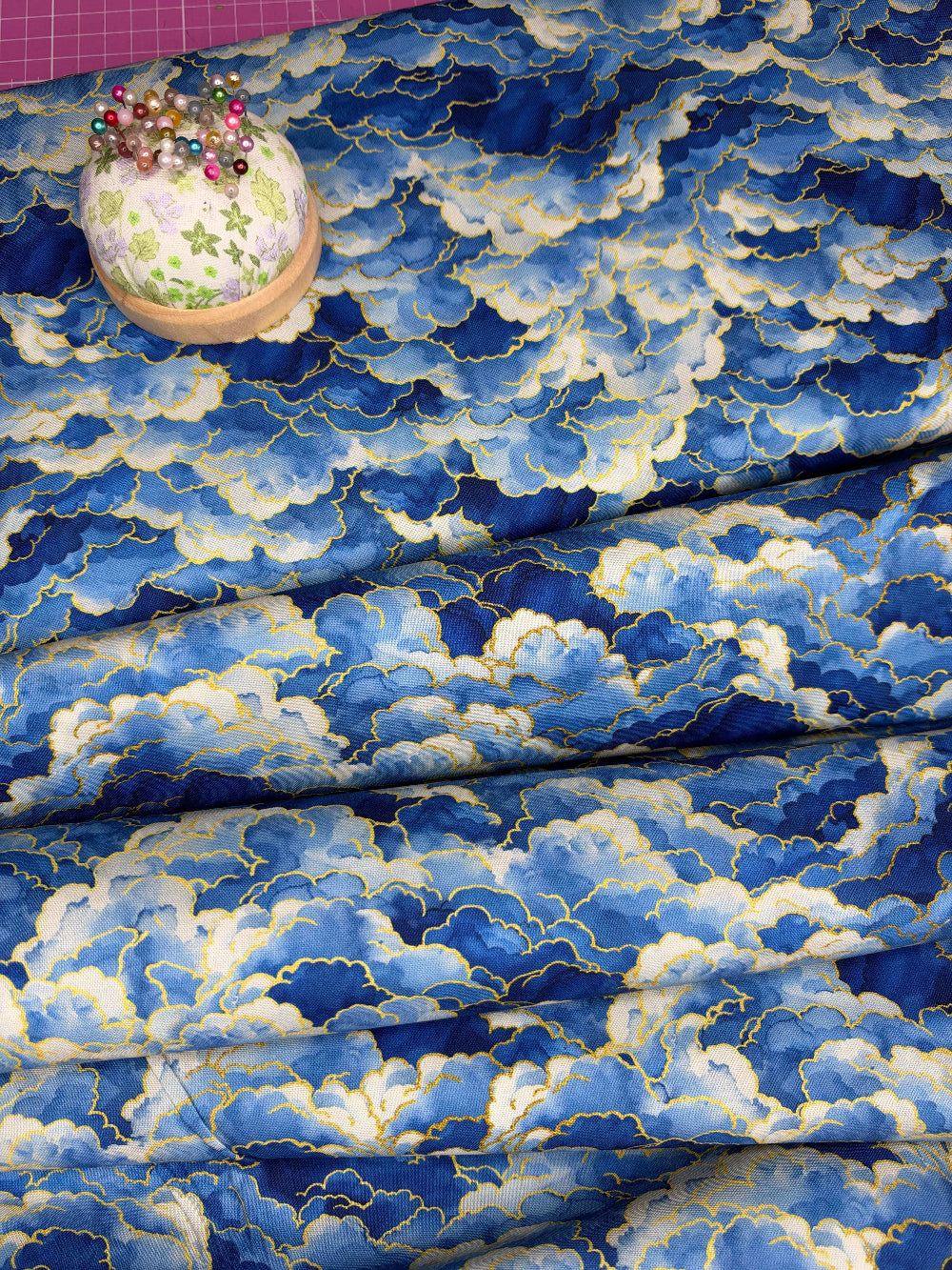 blue white and gold clouds fabric