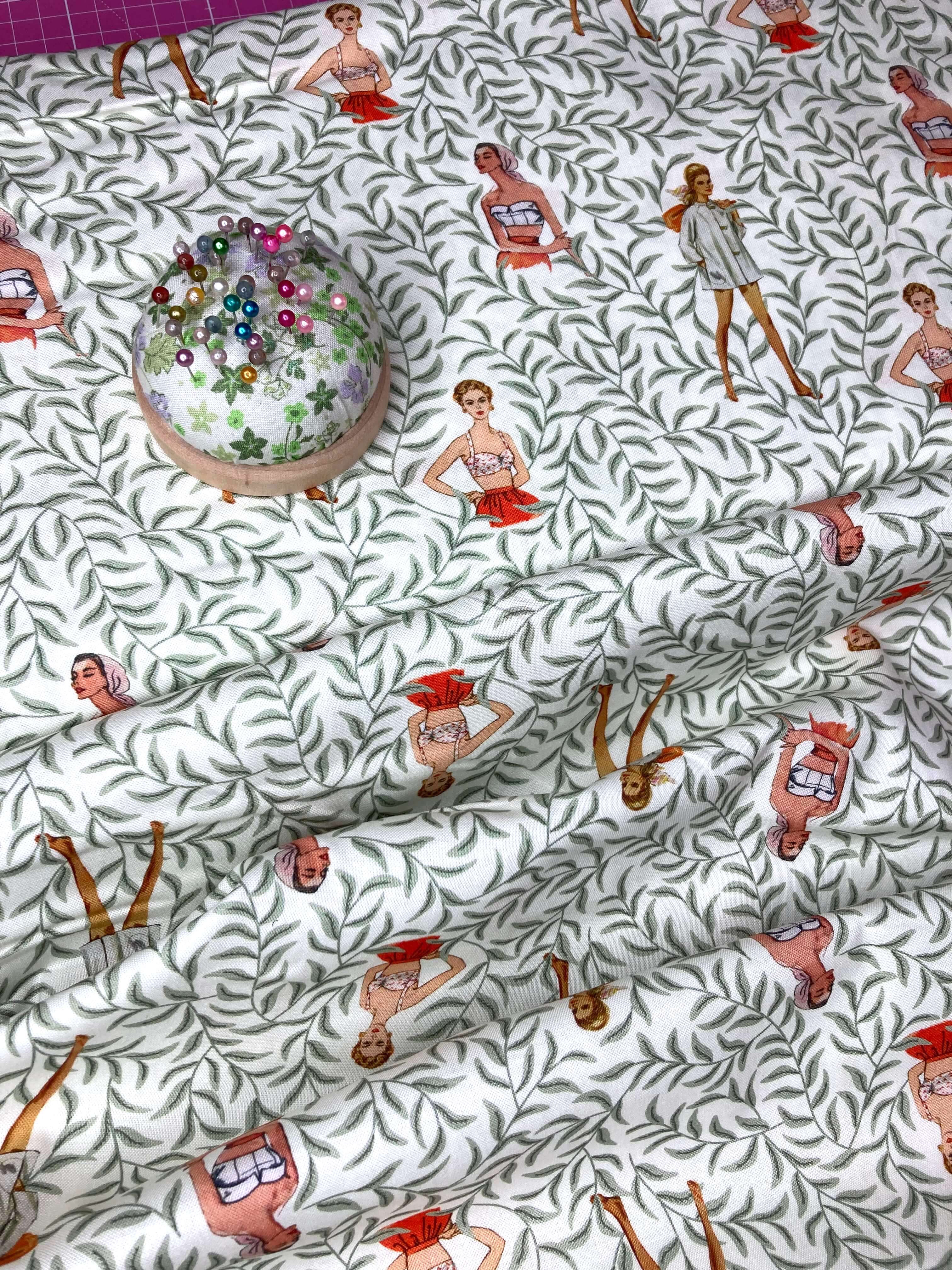 retro ladies on a white cotton fabric with lush green vines